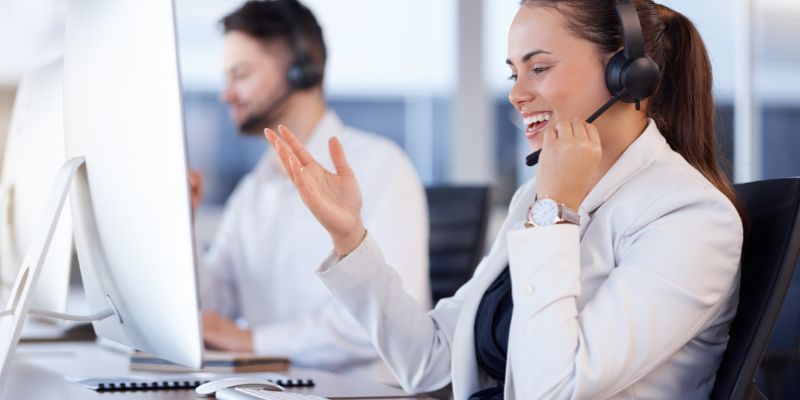 a woman wearing a headset and smiling